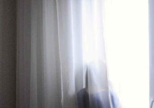 woman standing by the window